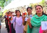 "Women making their voices heard at the polls—celebrating the strength of their vote."